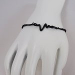 Feines schwarzes Armband Design Ondes