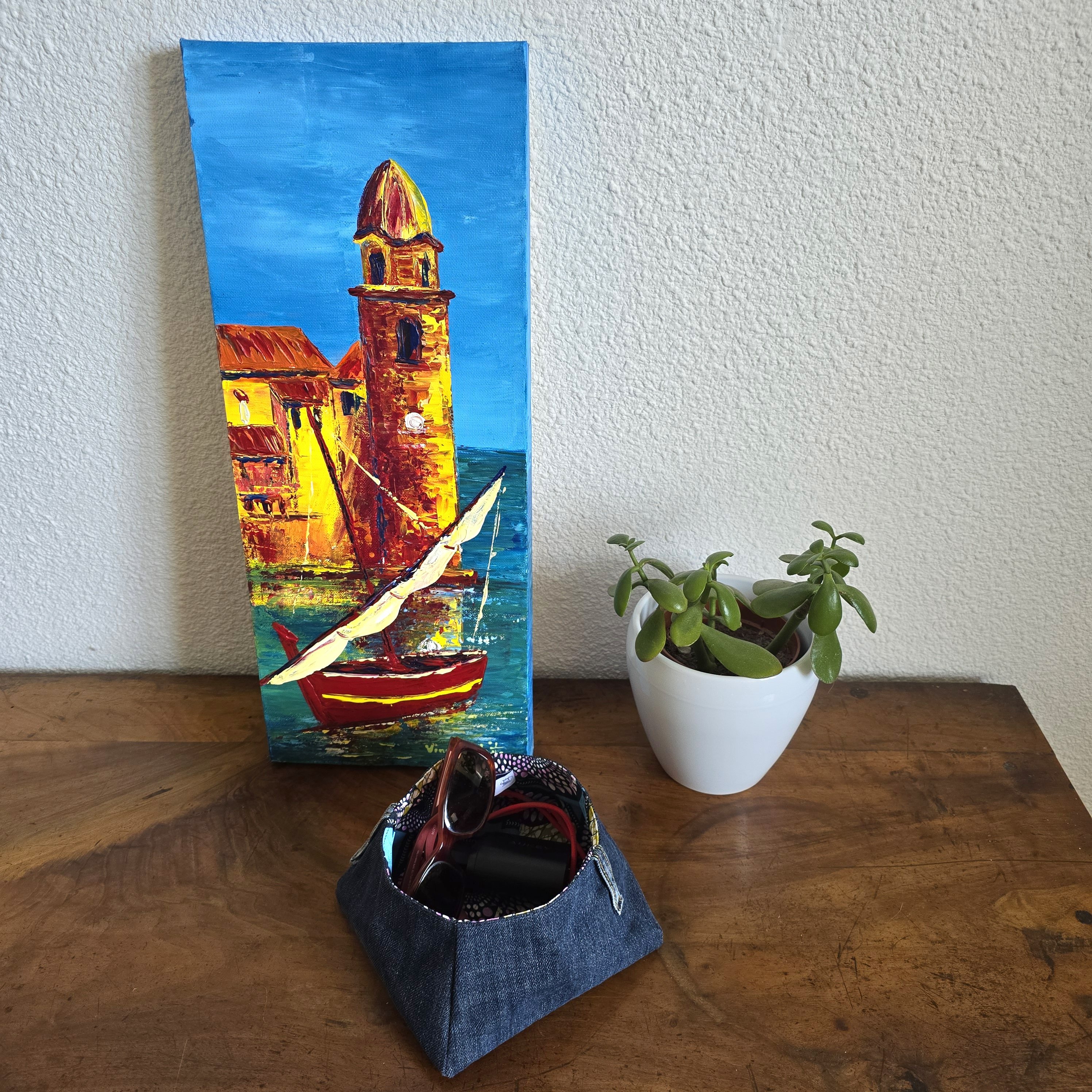 Vide poches en jean , doubl&eacute; de tissu coton imprim&eacute; wax.