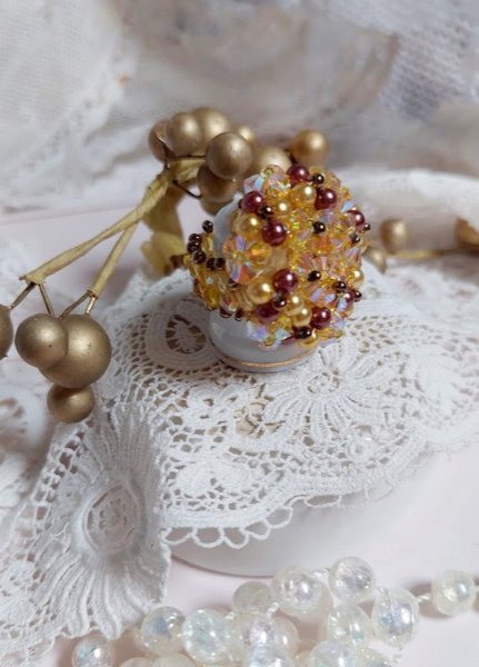 Sonnen-Ring mit Facetten, Perlmuttperlen und Kreiseln aus Swarovski-Kristall