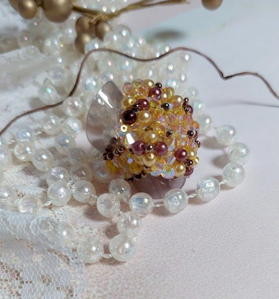 Sonnen-Ring mit Facetten, Perlmuttperlen und Kreiseln aus Swarovski-Kristall