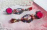 BO Maria und Jesus kreiert mit Harzcabochons, facettierten Birnen in der Farbe Rot und verschiedenen Accessoires